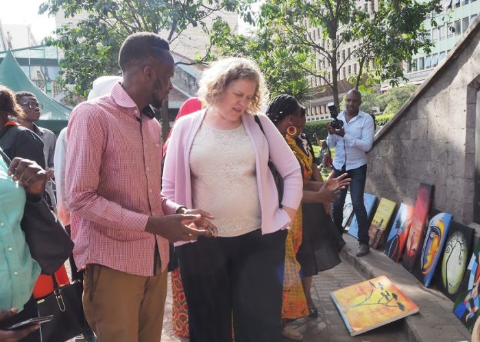 US Embassy Cultural Attache" Appreciating Artworks During the Nairobi Peace Ambassadors Graduation.